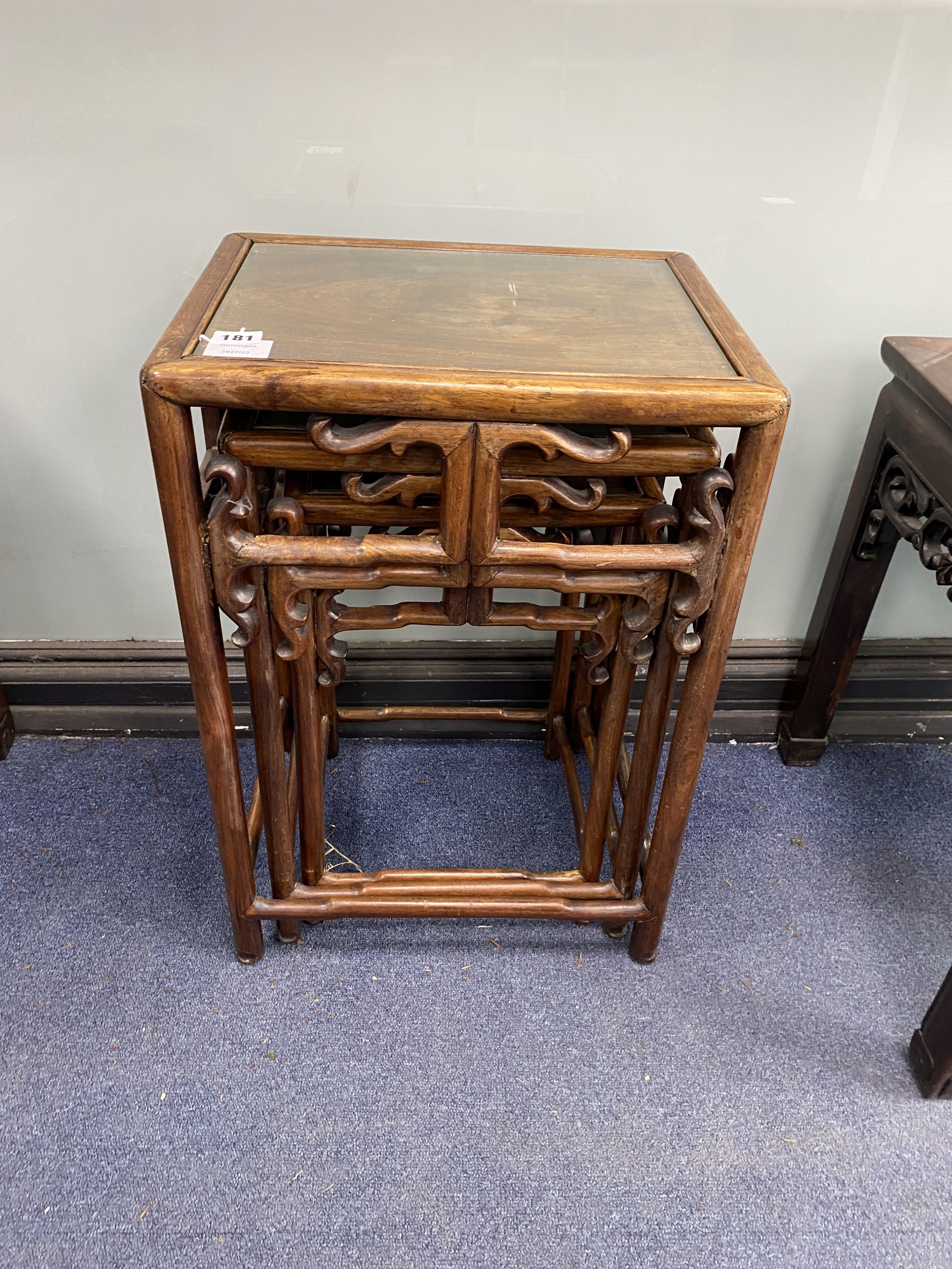 A nest of three Chinese hardwood tables, width 40cm, depth 32cm, height 59cm